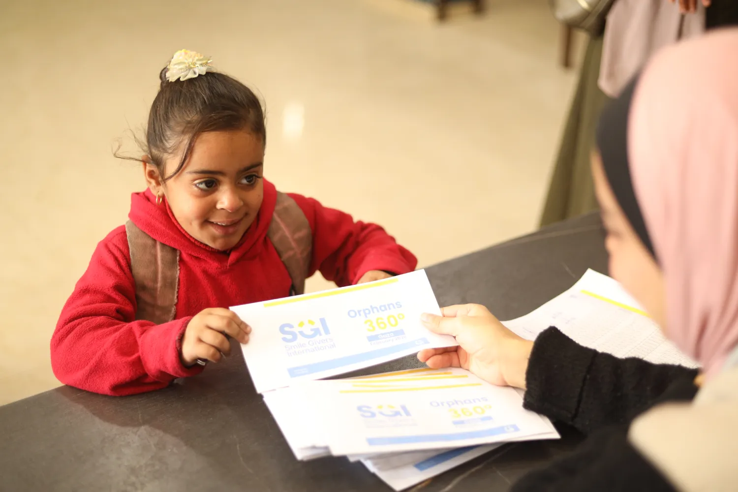 Orphan child receiving support from SGI