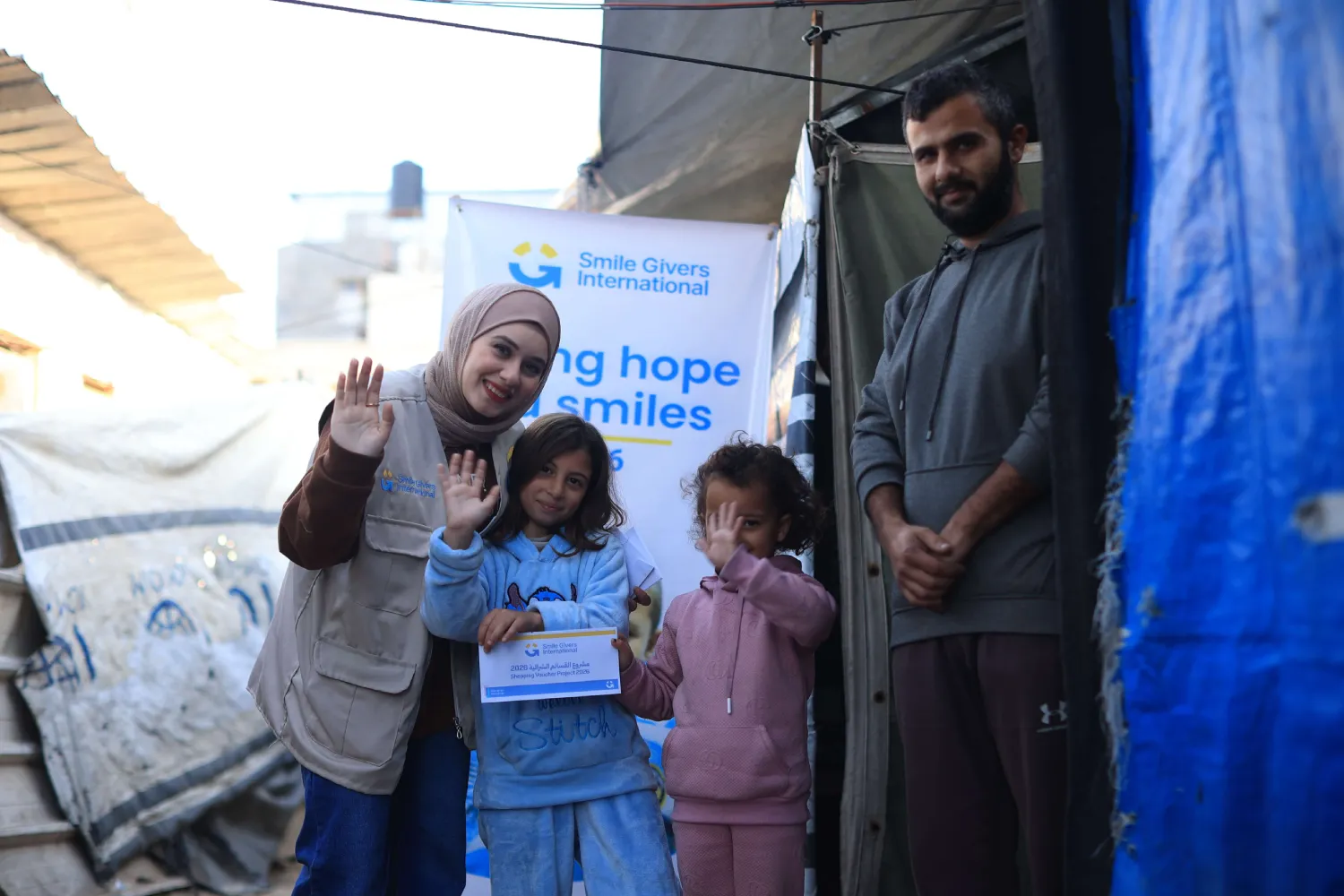 Family receiving Zakat support from SGI