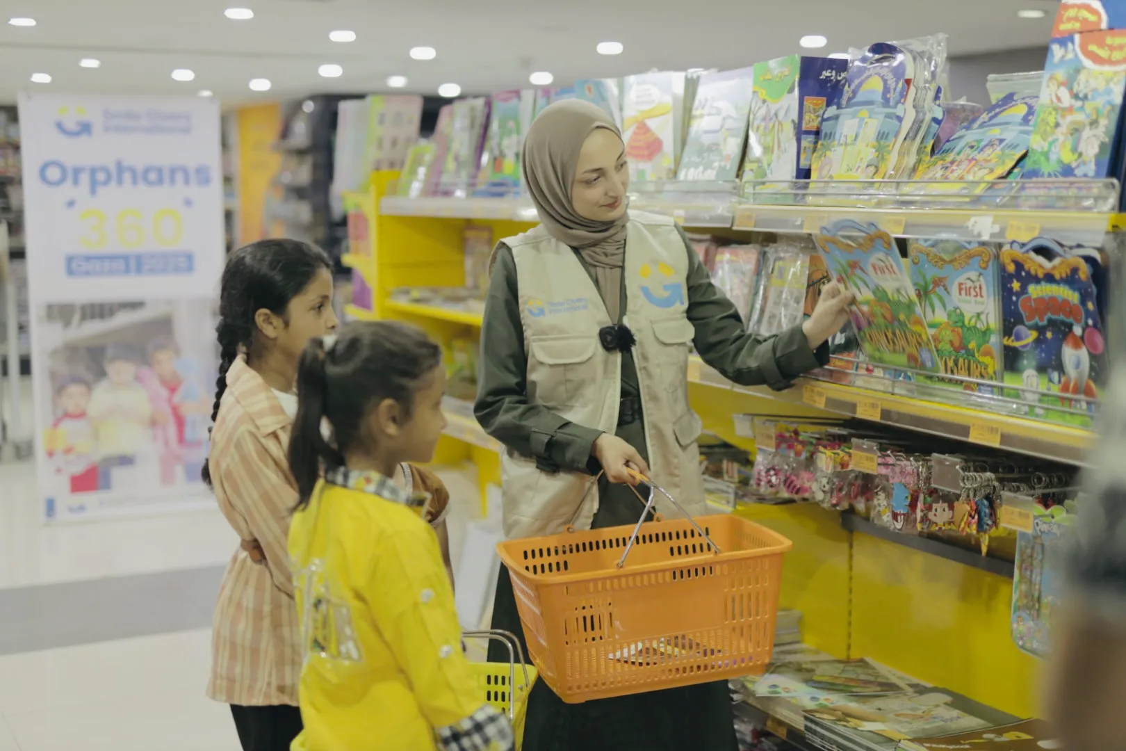 SGI worker shopping for books and supplies with orphan girls