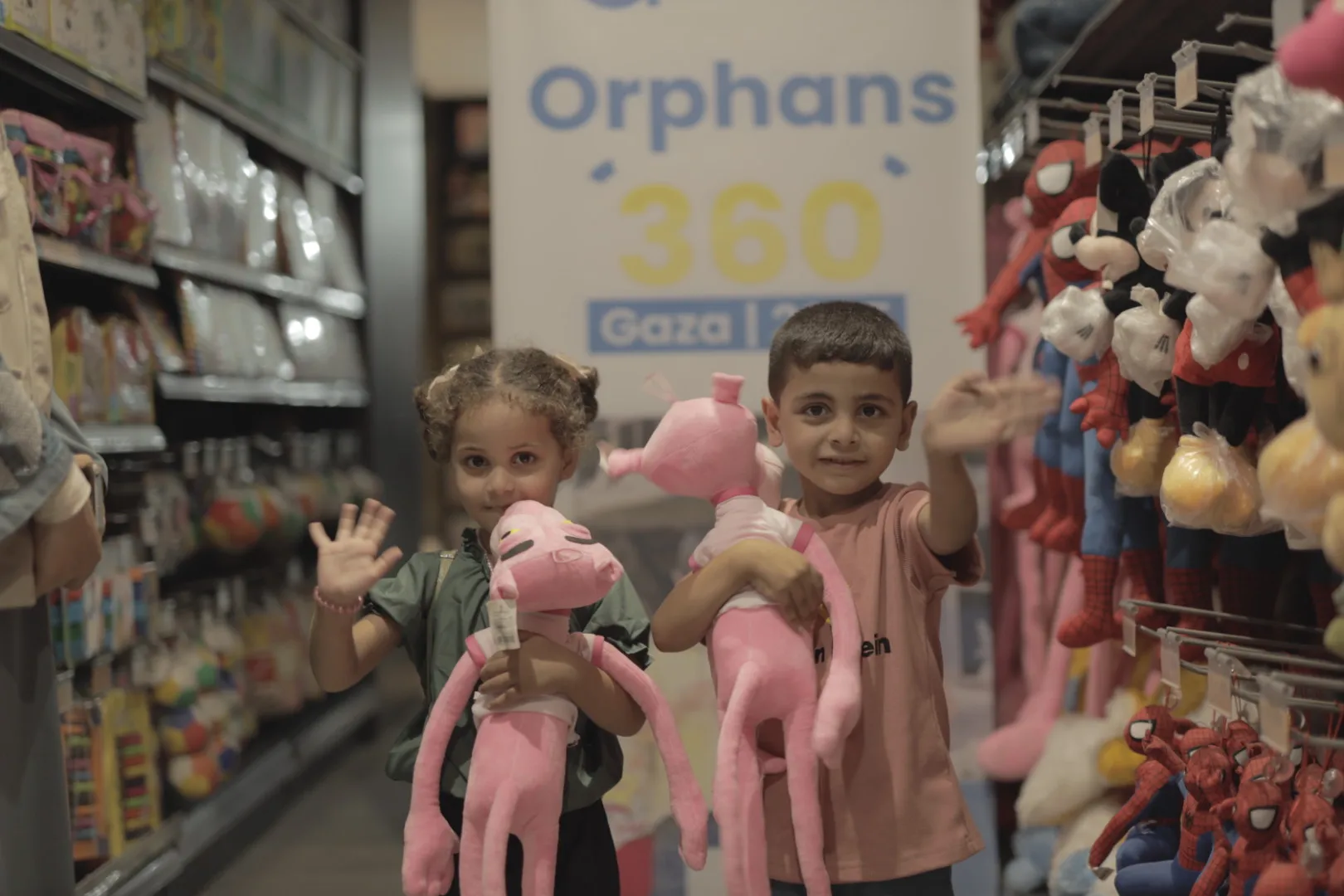Orphan children holding stuffed toys at SGI event