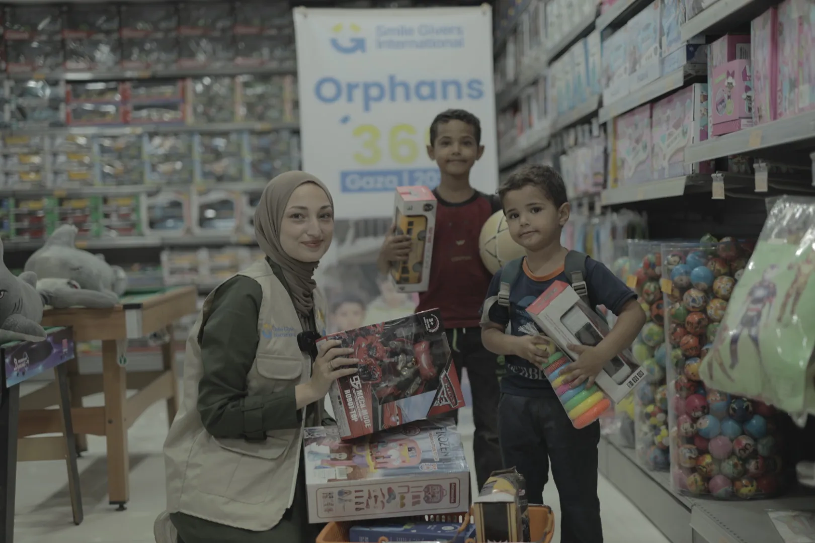 SGI worker with orphan boys picking out gifts